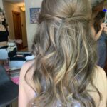 half up half down hairstyle with soft romantic curls and subtle twists for bridesmaid