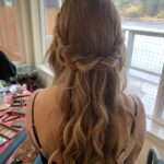 loose, romantic braid and curls with half up half down wedding hairstyle