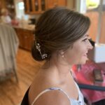 side view of elegant updo with accent hairpin lasts all day